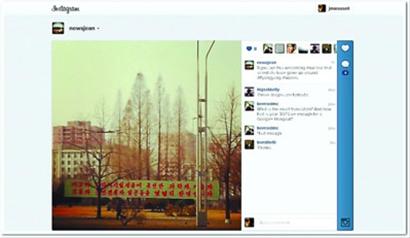 外國記者吉恩在朝鮮用手機(jī)發(fā)布的第一張Instagram照片平壤街頭的橫幅標(biāo)語。